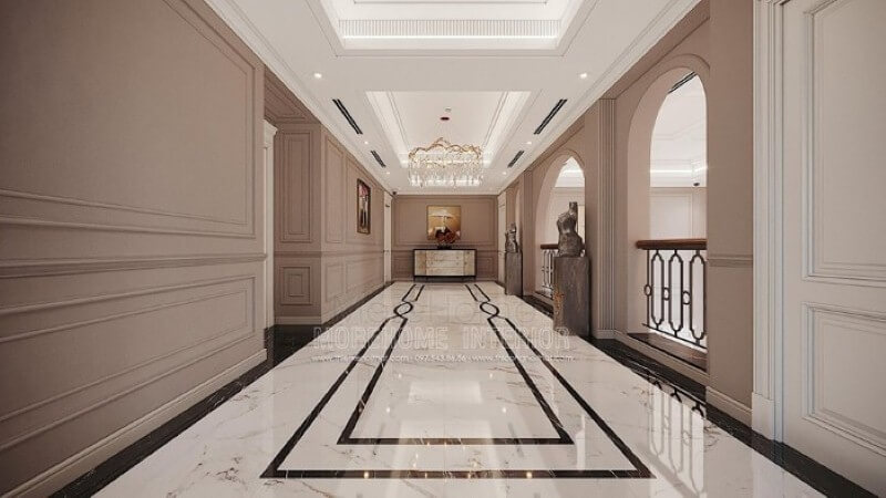 Trang trí hành lang đẹp ấn tượng từ sàn lát đá cao cấp, phào chỉ tường đẹp cùng đèn trang trí pha lê ấn tượng.
